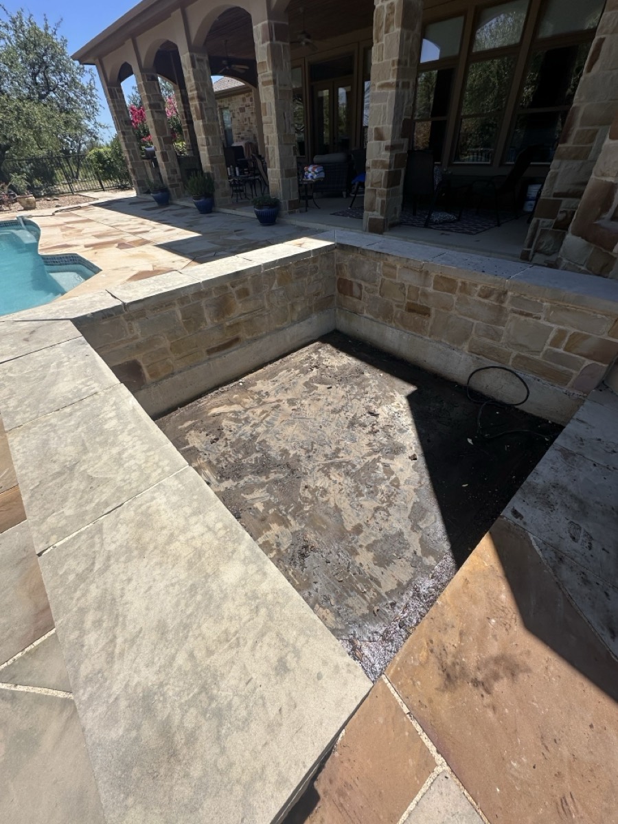 Clean, cleared patio space after JT Junk Solutions removed the hot tub