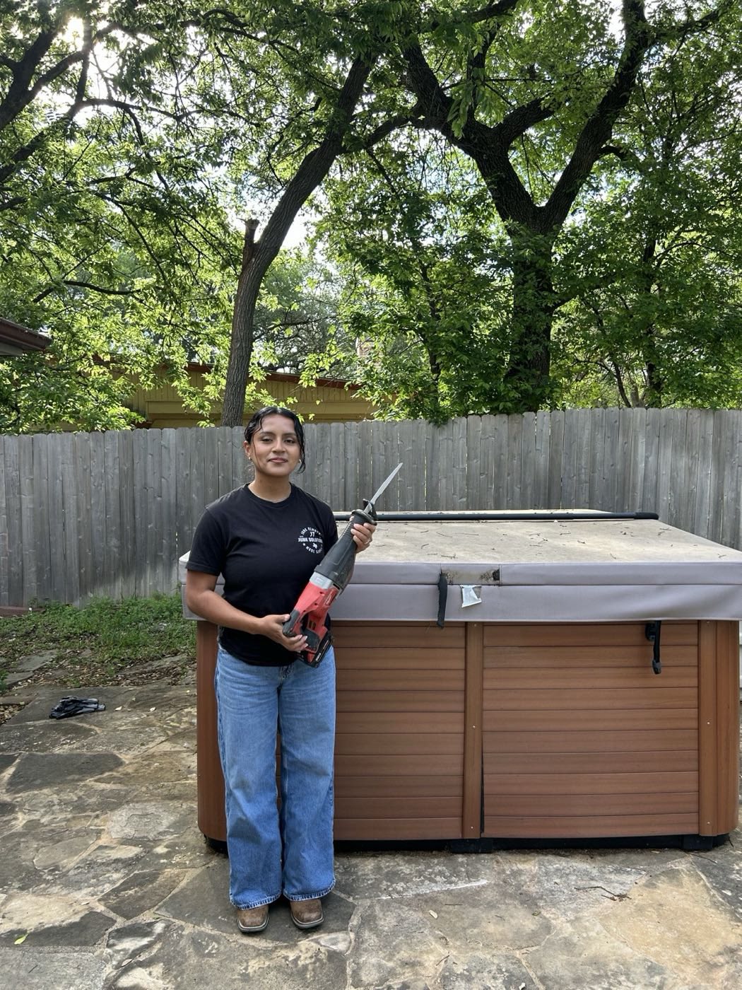 JT Junk Solutions removing a hot tub in a Central Texas backyard